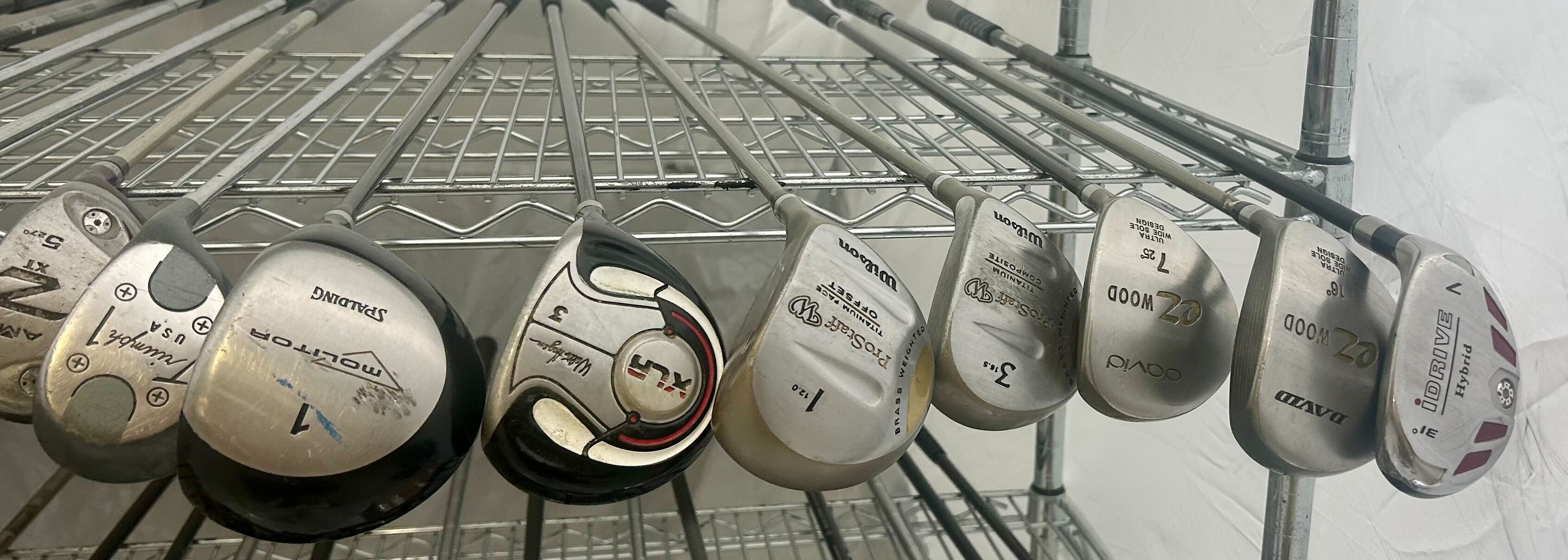 Wholesale Lot of 35 Golf Clubs - Assorted Wilson, Drivers, Woods, and Hybrids-Next Round